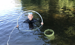 Danny Szydlowski sampling for aquatic snails