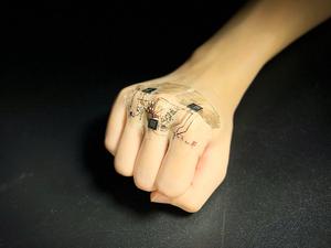 An advanced e-skin prototype that has soft electronic circuits integrated with commercial hardware