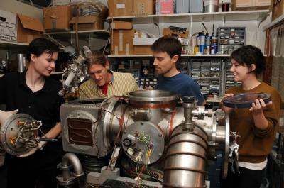 The Authors Performing Maintenance on an Atom-beam Chamber