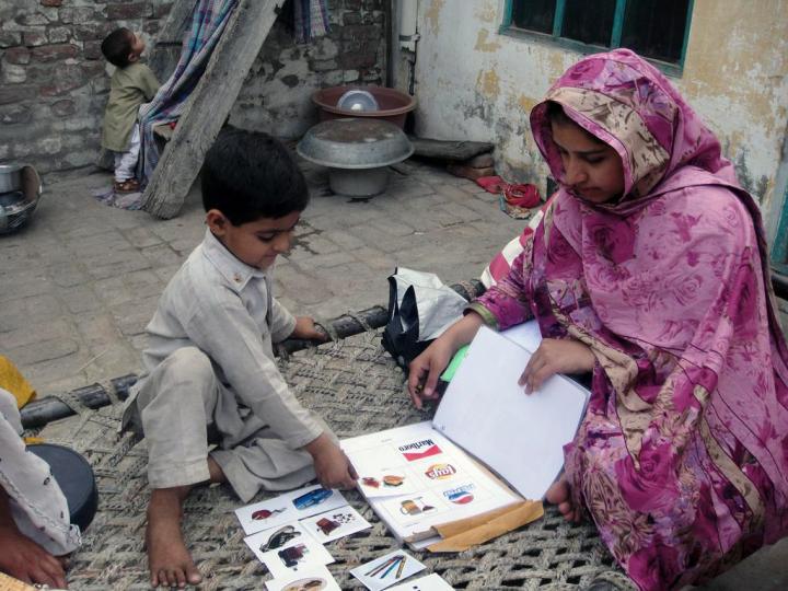 Young Indian Child Performing An Activity to Match Different Logos with the Item It Might Represent
