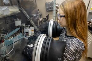 Scientist uses a glovebox