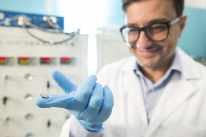 Prof. Ciucci showing a protonic ceramic fuel cell made from D-BFZ