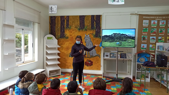 Researcher talking at a school