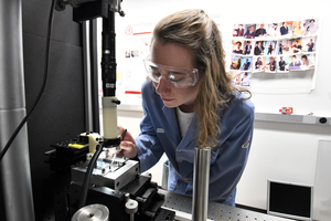 UMass Amherst graduate student Cynthia Bukowski testing the strength of a polymer film.