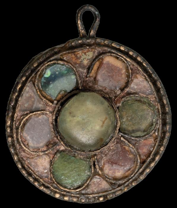 An Avar-period coat clasp with glass inlay