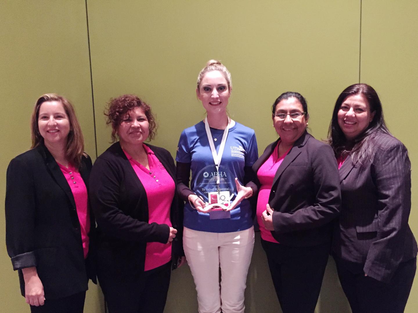 UTHealth Community Health Workers Accepting Award At The APHA Conference