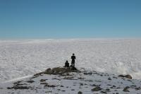 Research scientists overlooking the vast expanse of Leverett Glacier, Greenland