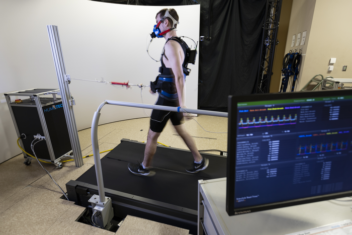 Robotic Waist Tether for Research Into Metabolic Cost of Walking