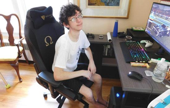 Alexander enjoying the gaming computer he assembled himself