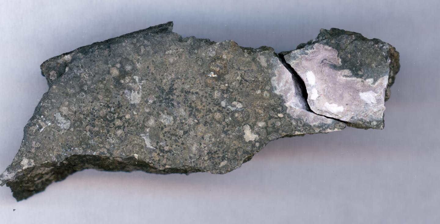 Meteorite Inclusion Leads to Evidence for Curium at Solar System Formation