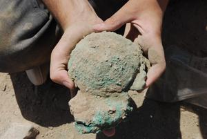 Remains of three copper ingots found during the excavation