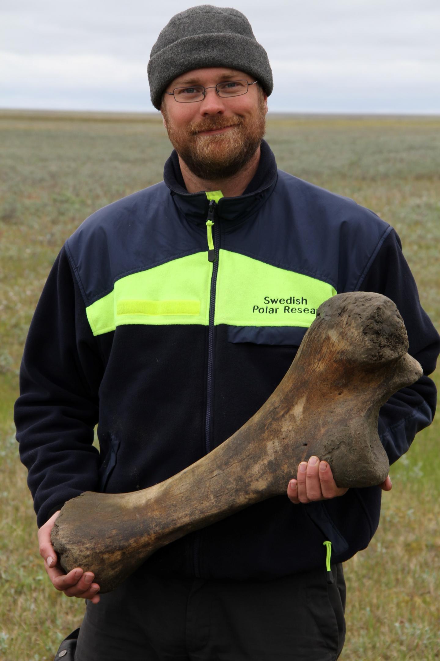 Researcher with Mammoth Bone
