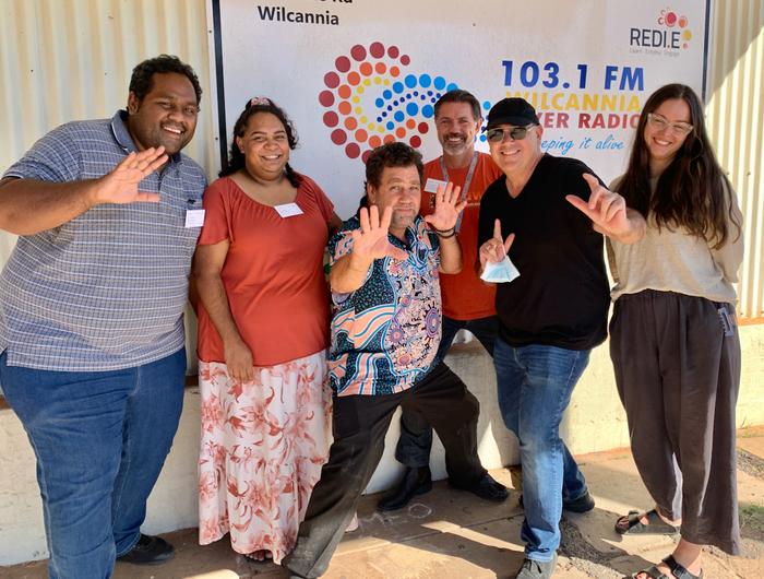 Photo of Mapping the Digital Gap research team in Wilcannia: Left to right: Anthony  Wiltshire, Shaylin Whyman, Brendon Adams, Dr Daniel Featherstone, Dr Lyndon OrmondParker, and Dr Indigo Holcombe-James