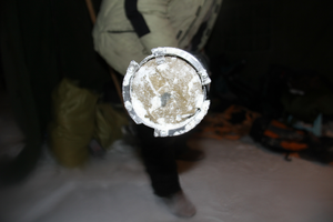 The last run of the Chongce ice core drilling in 2012, showing the sediment inside of the drill barrel (courtesy Shugui Hou)