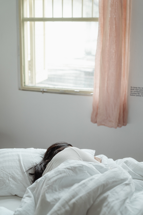 A woman sleeping in bed.