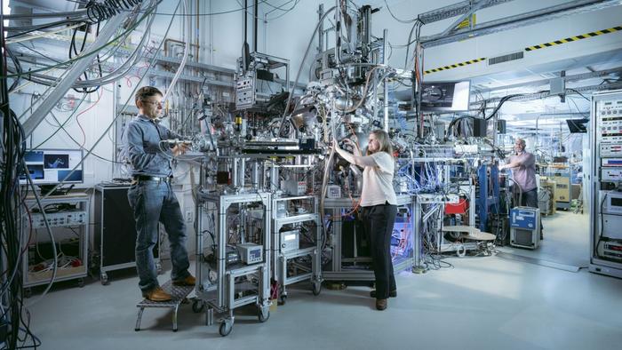Preparing for initial test measurements, Dr. Peter Nagel, Dr. Karin Kleiner and Amir Ghiami (left to right) feed the beam into the new NAPXAS instrument at the WERA beamline at the KIT Light Source.