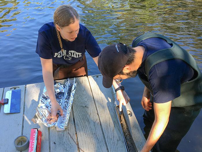 Researchers collecting cores at the inlet to the John Heinz National Wildlife Refuge