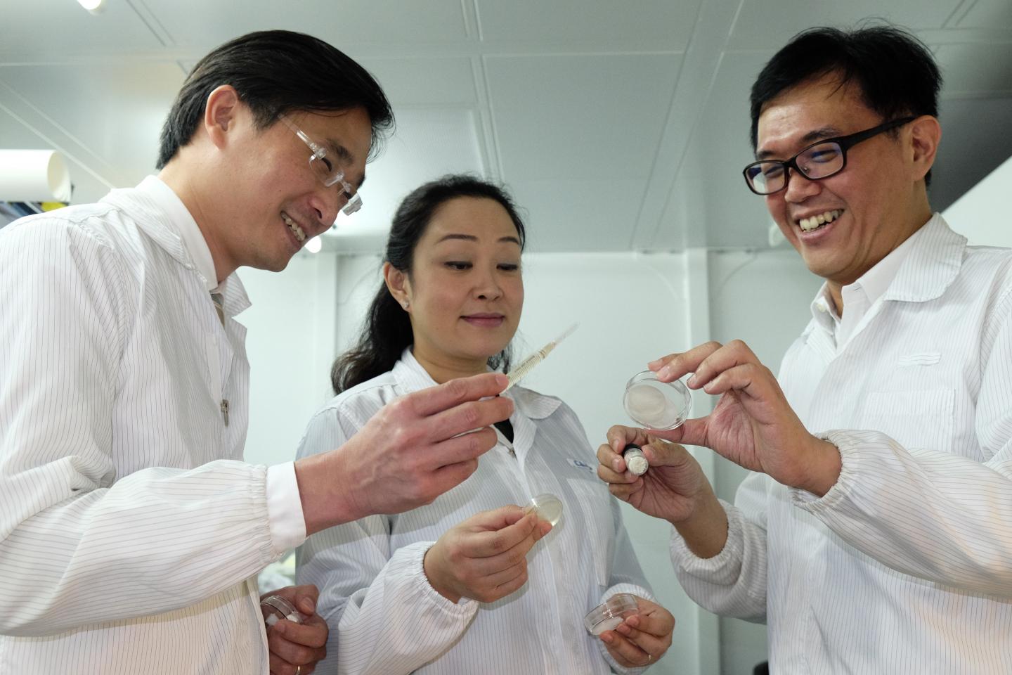 NTU Assoc Prof Andrew Tan, NTU Asst Prof Cleo Choong and their clinical partner Dr Marcus Wong, discussing their research