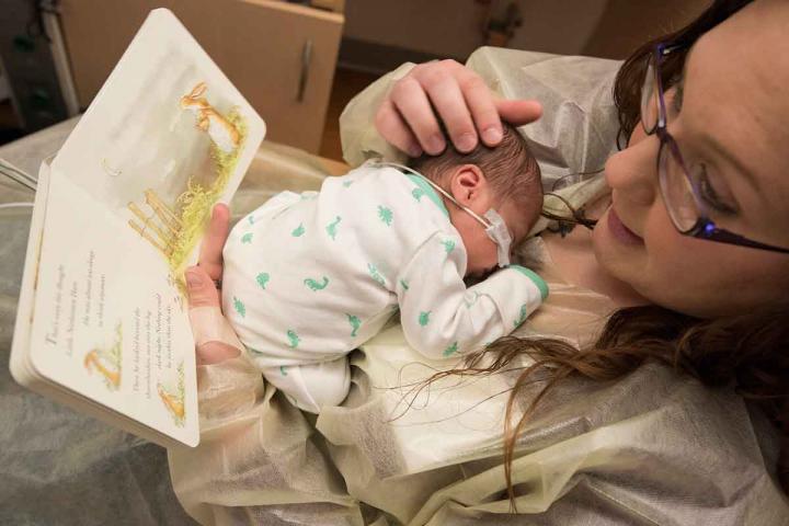 Mom Reading to Baby