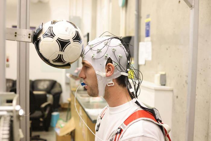 Soccer headers briefly slow brain activity, study shows