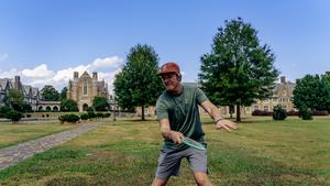 Undergraduate student, Calvin Teague, demonstrates an optimal thumb grip on a mid-range disc.