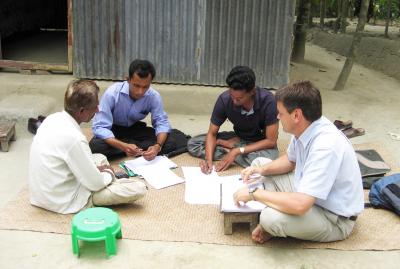 Dr. Peter Davis and Researchers Interviewing a Local Villager