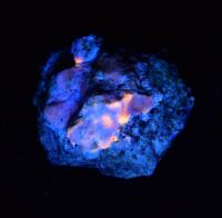 Hackmanite With an Afterglow and Extremely Versatile Composition. Photo Taken in UV Light