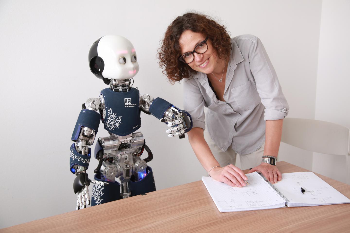 Agnieszka Wykowska interacting with the humanoid robot iCub