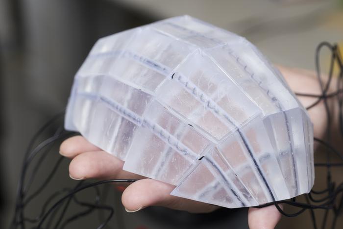 A prototype RoboFabric helmet which can be flat-packed