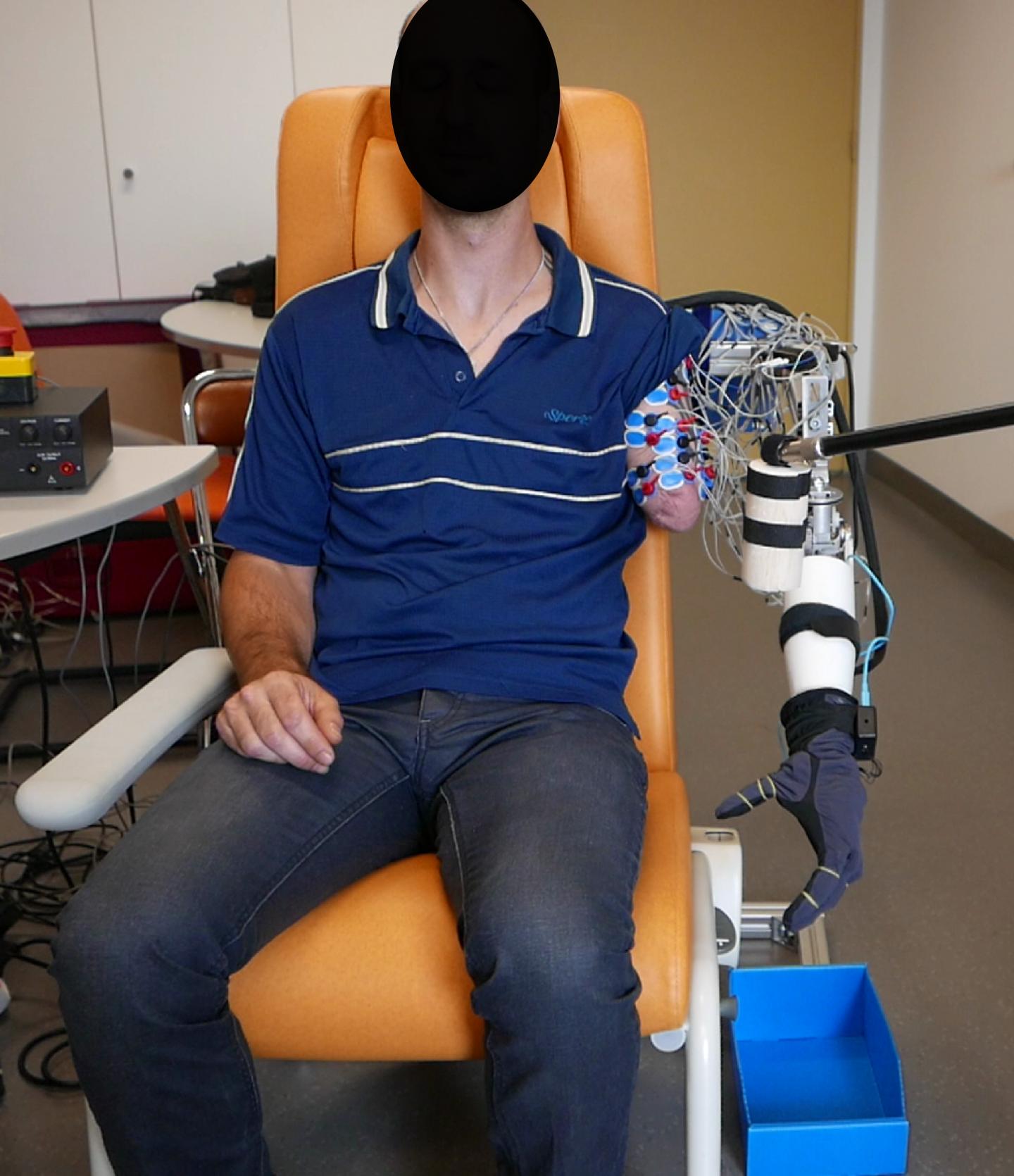 One of the Participants During the Experiment, Bending His Elbow to Grasp the Cylinder