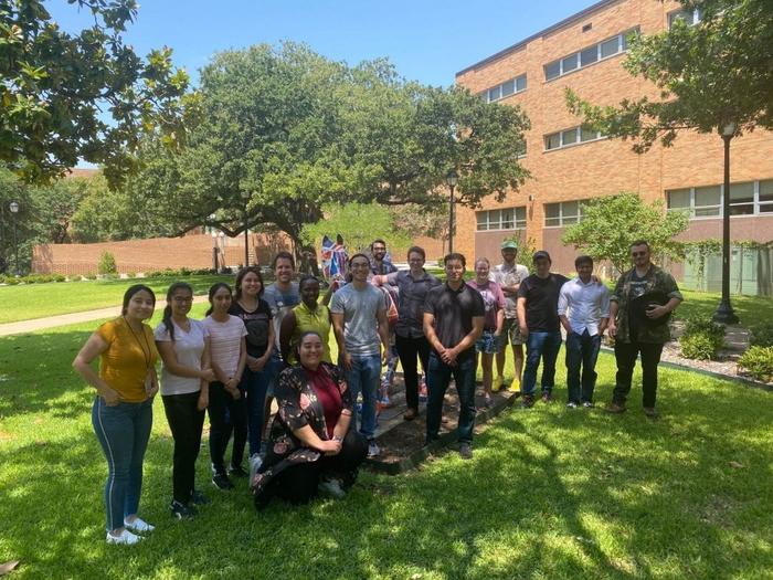 The cohort of eight NREMST trainees and their mentors on UTA’s campus in August 2023