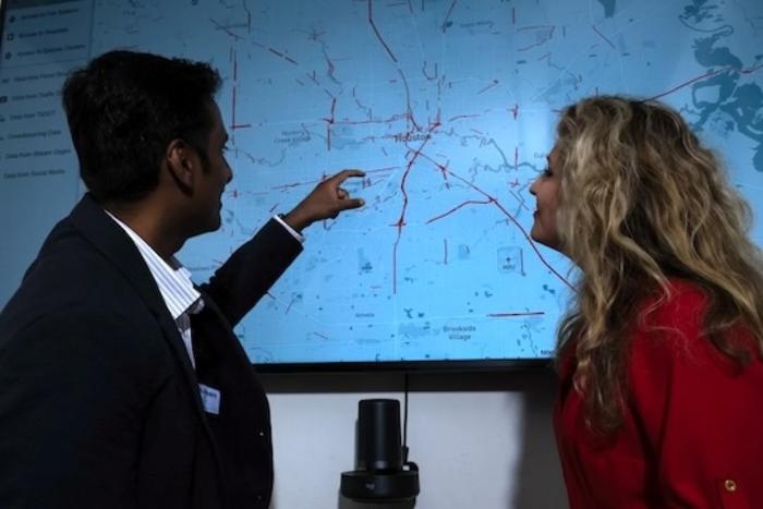 Rice engineers Pranavesh Panakkal (left) and Jamie Padgett (right) analyze a map of road links in the Houston area