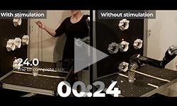 Brain-computer interface user Nathan Copeland is using a robotic arm to manipulate objects.