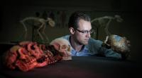 Dr. Alistair Evans, Monash University, with Hominin Skull Casts