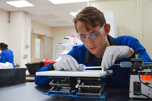 Student working with soft robot