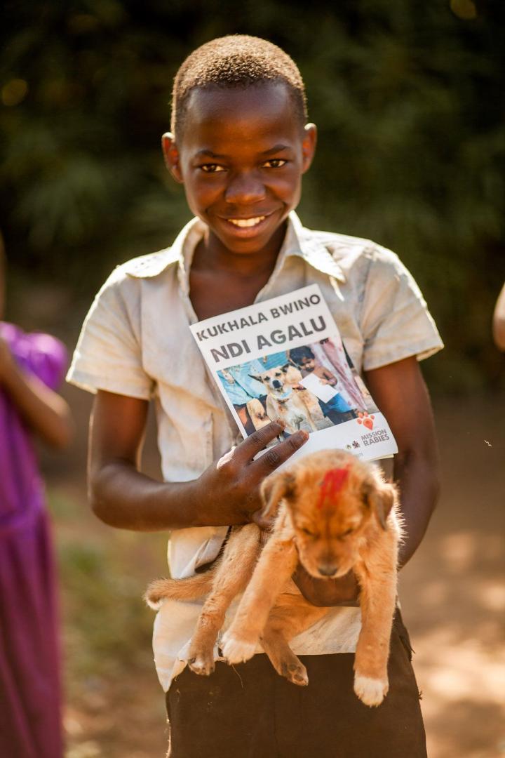 A child brings his puppy for vaccination