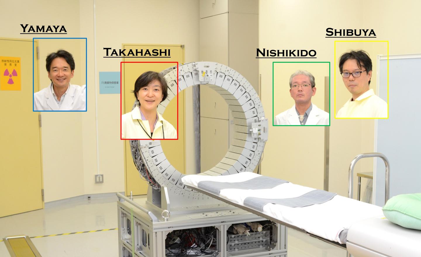 Researchers and a prototype PET scanner being remodeled to detect the lifetime of positrons