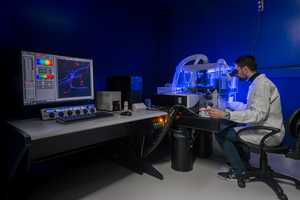 Mattia Volta examining samples at the microscope