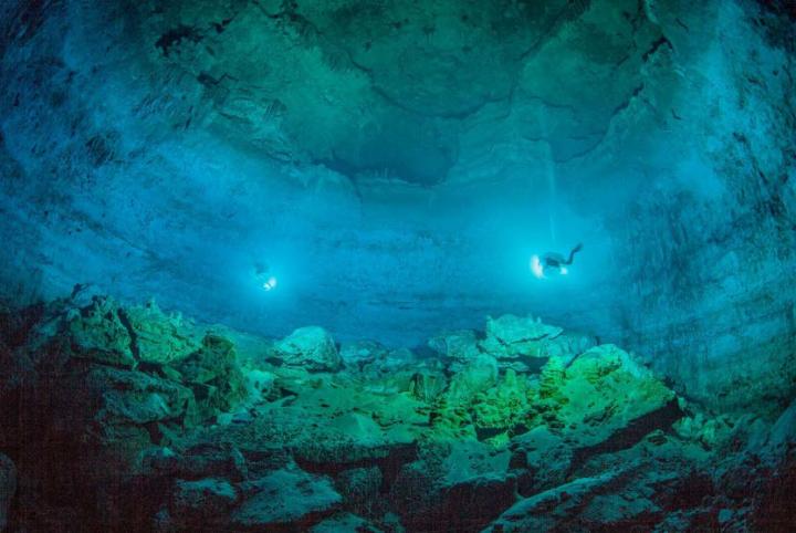 Image 3 Hoyo Negro Well Lit By the Lights of Cave Divers