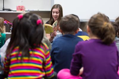Teacher Reading to Student