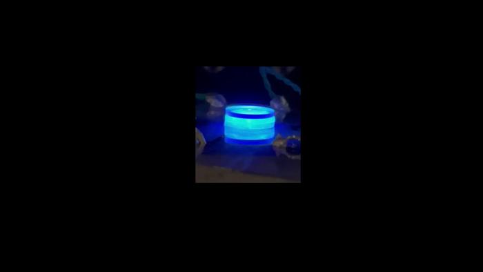 Spinning Glowing Blue Water Drop
