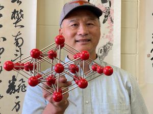 Jung-Fu Lin with atomic model