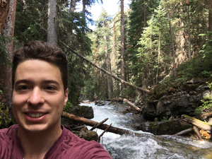 Brian Saccardi collecting stream data from the East River watershed, Colorado