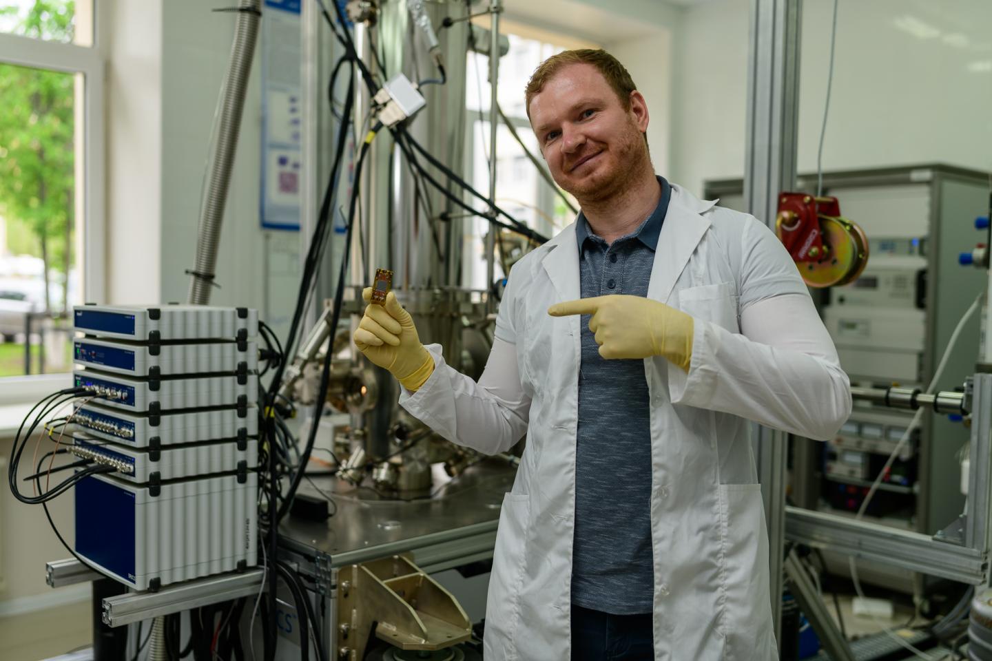 Photo. Igor Golovchanskiy with a chip under investigation in his hands.