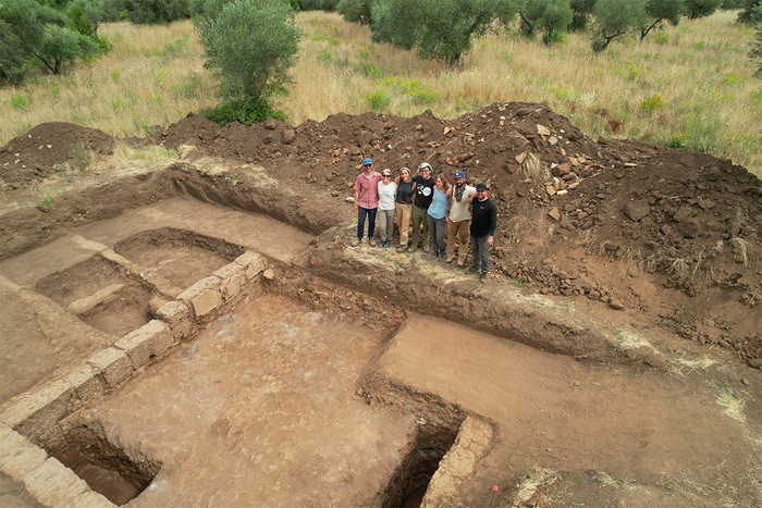 Seth Bernard and his team of graduate students stand in front of a trench in Falerii Novi