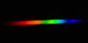 An intense white-light laser casts a brilliant rainbow, as demonstrated by a photo from the experiments conducted by L. Hong’s team at South China University of Technology.