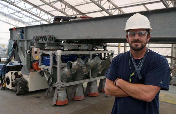 U.S. Naval Research Laboratory’s (NRL) Center for Corrosion Science and Engineering engineer Jimmy Tagert installs an improved Thermal Spray Nonskid (TSN) on the USS Kearsarge (LHD-3)