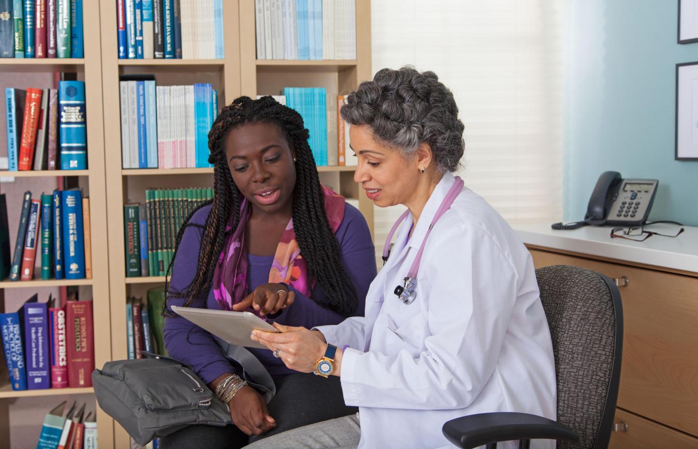 Woman Speaks with Her Doctor
