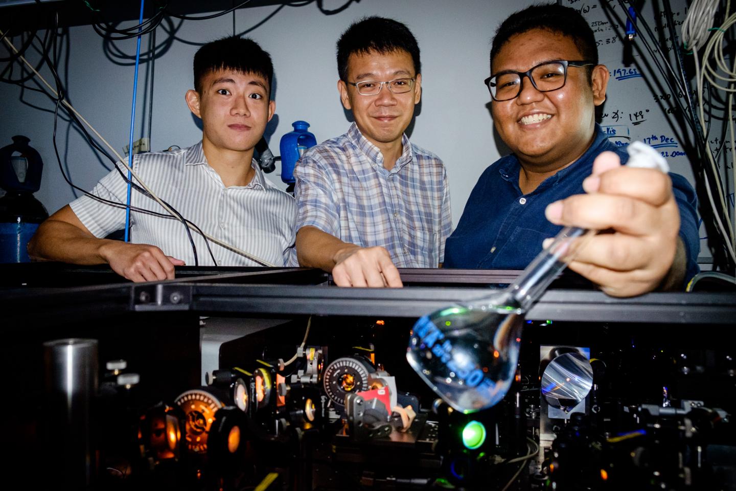 Loh Zhi-Heng with his NTU Research Team, Where They Are Conducting Tabletop Experiments on Water
