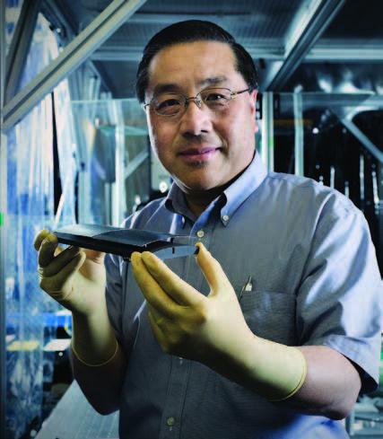 Will Zhang Holds Silicon Mirror Segments